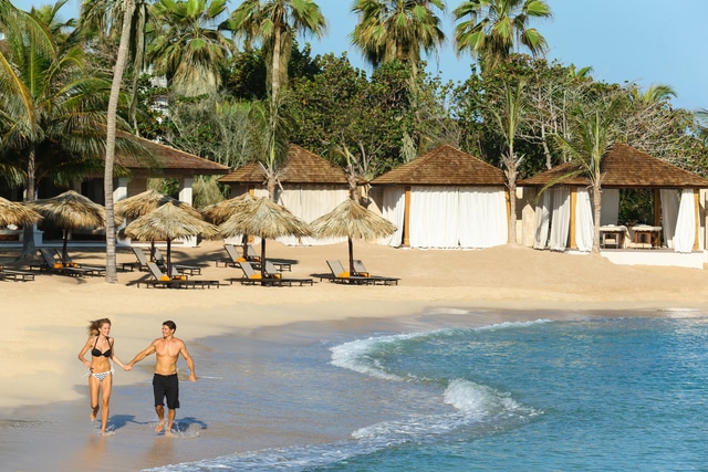 Hyatt-Zilara-Rose-Hall-Couple-Running-Down-Beach