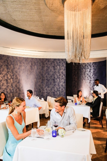 Hyatt-Zilara-Rose-Hall-Petit-Pariz-Couple-Having-Dinner-Vertical